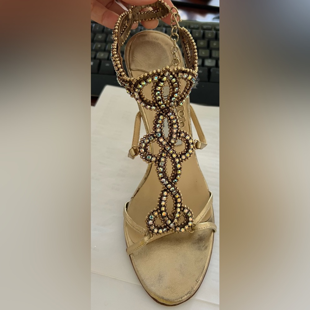 Jimmy Choo Gold Slingbacks with rhinestones.